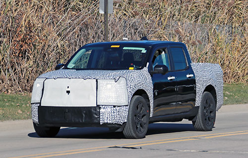 Front view of a Ford Maverick in camouflage