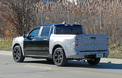 Rear view of a Ford Maverick in camouflage